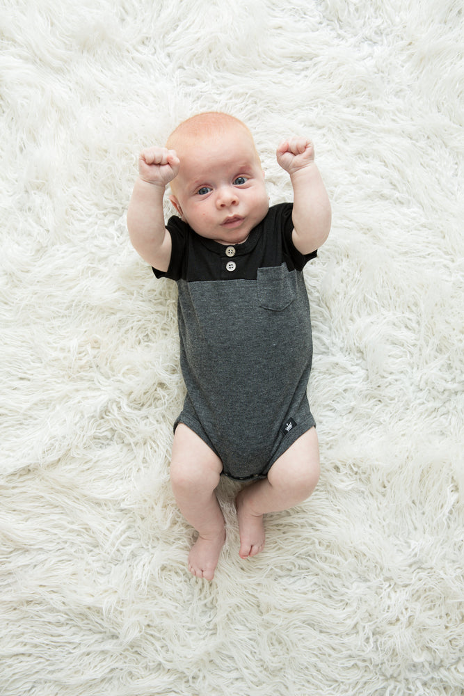 The Littlest Prince Black & Charcoal Block Henley Shirt is for the fashionable little gentleman who likes to take casual up a notch. This cool t-shirt is super comfy and can even be worn under a nice sports jacket with jeans. This set is perfect for stylish brothers as well as for matching daddy!