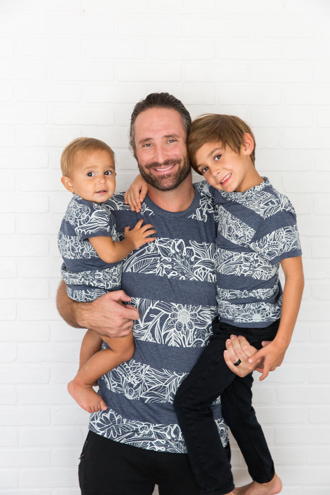 The Littlest Prince Navy & Cream Tropical Tee is perfect for island vacations or Spring/Summer days. The tropical print along with the bold blue colors will definitely have your little man standing out. This set is perfect for stylish brothers as well as for matching daddy